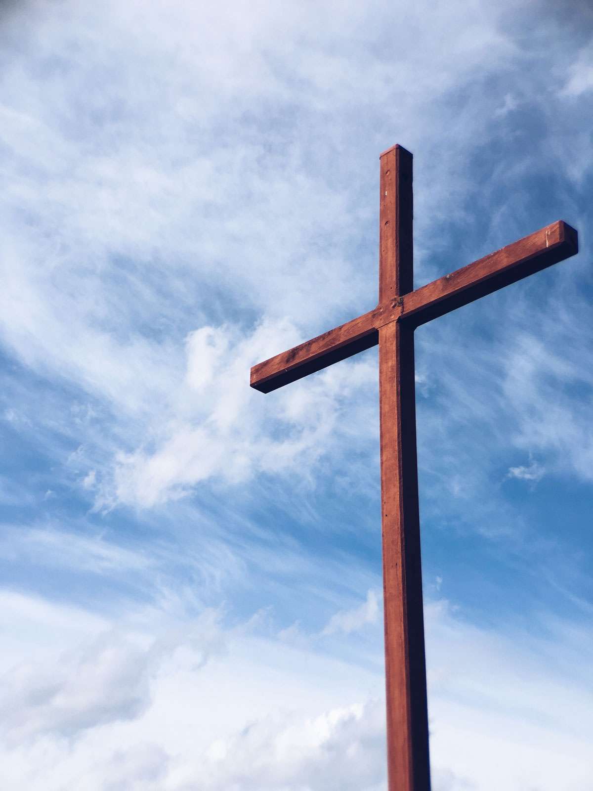 christian cross with sky background and some cloud